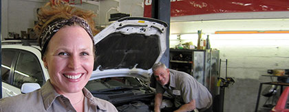 AATCO Transmission owners in front of their Montrose auto repair shop